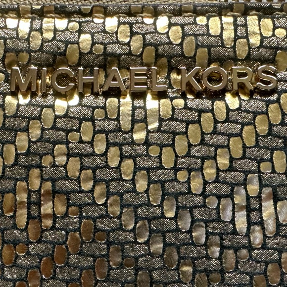 A golden Michael Kors “Adele” Smartphone Wristlet - Picture 3 of 6